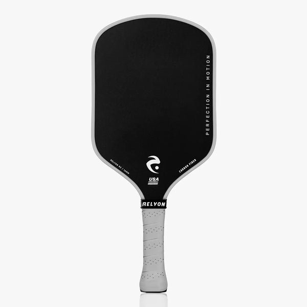 Black and gray pickleball paddle with RELYON branding on a white background