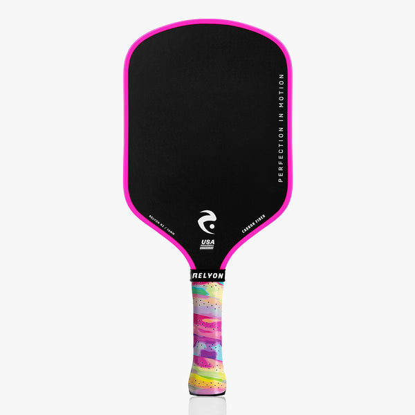 A black pickleball paddle with a bright pink border and a colorful, patterned handle featuring abstract pastel designs. The paddle is branded 